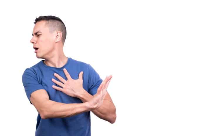 Man with a wounded heart gesturing to reject something
