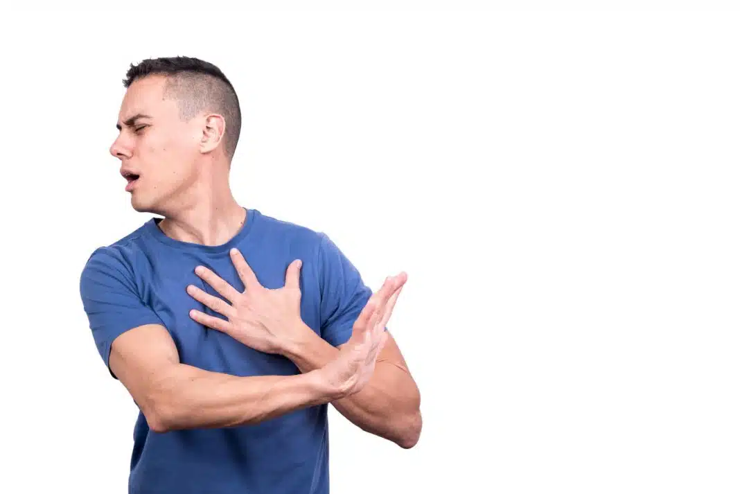 Man with a wounded heart gesturing to reject something